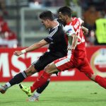 Skenderbeu's Kristi Vangjeli (R) vies with Besiktas' Mario Gomez (L) during the UEFA Europa League Group H football match between KF Skenderbeu and Besiktas JK at the Elbansan Arena in Elbasan on September 17, 2015. AFP PHOTO / GENT SHKULLAKU        (Photo credit should read GENT SHKULLAKU/AFP/Getty Images)