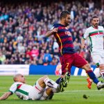 BARCELONA, SPAIN - JANUARY 09: Matheus Doria of Granada CF tackles Arda Turan of FC Barcelona during the La Liga match between FC Barcelona and Granada CF at Camp Nou on January 9, 2016 in Barcelona, Spain. (Photo by Alex Caparros/Getty Images)