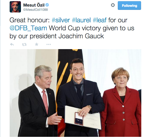 Mesut Özil being presented with the Silver Laurel Lead award